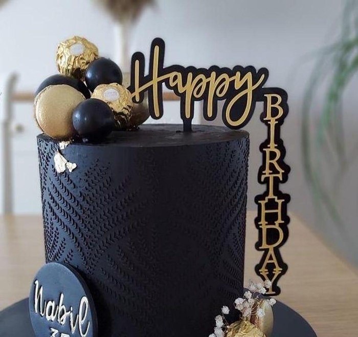 Black birthday cake with gold script laser cut Happy Birthday topper